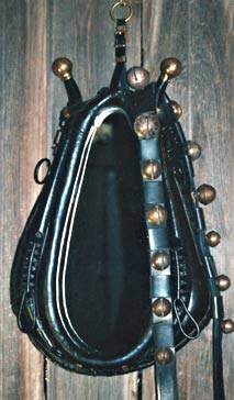 Horse collar sporting a set of 13 jingle sleigh bells.